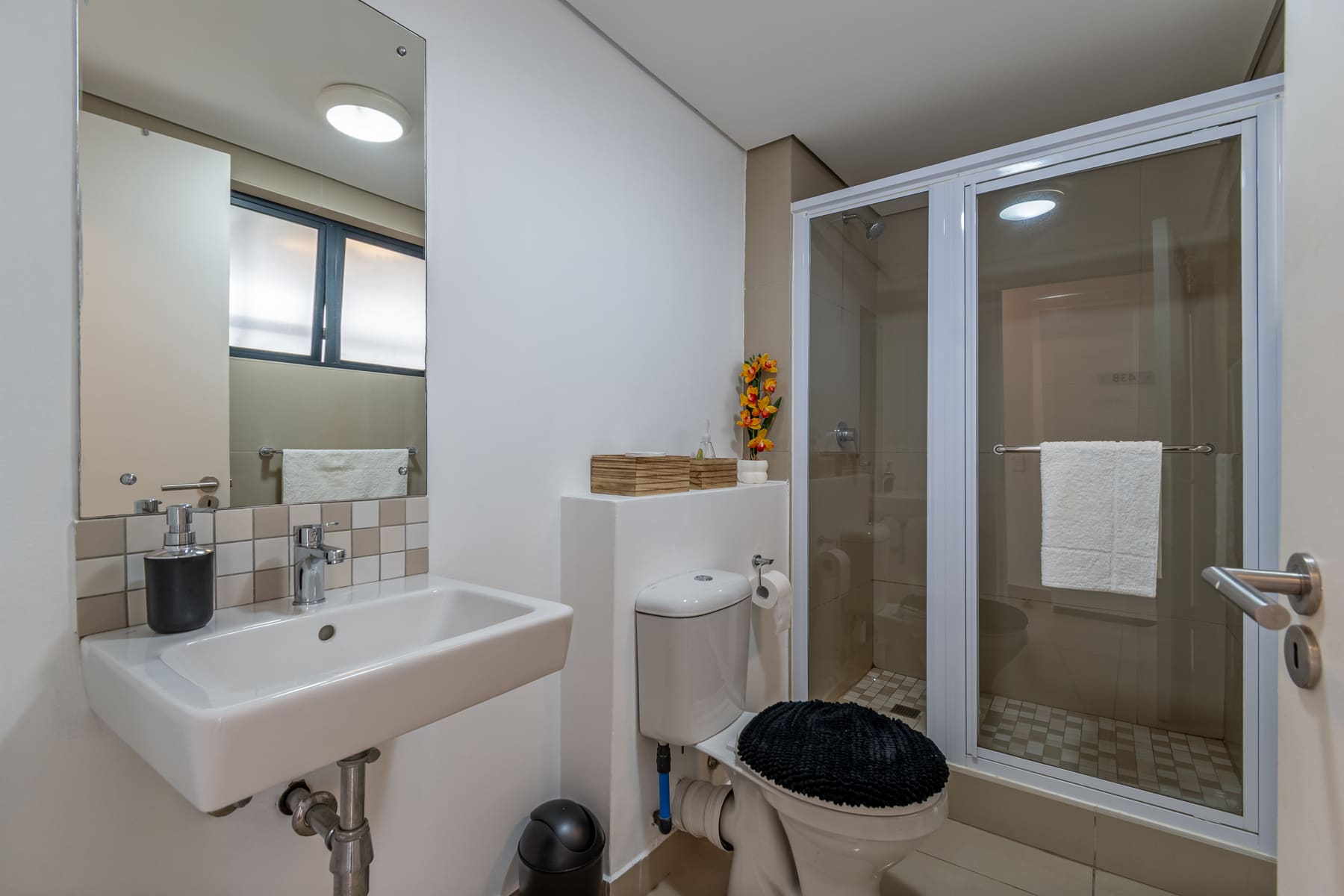 Bathroom with shower, toilet, and basin
