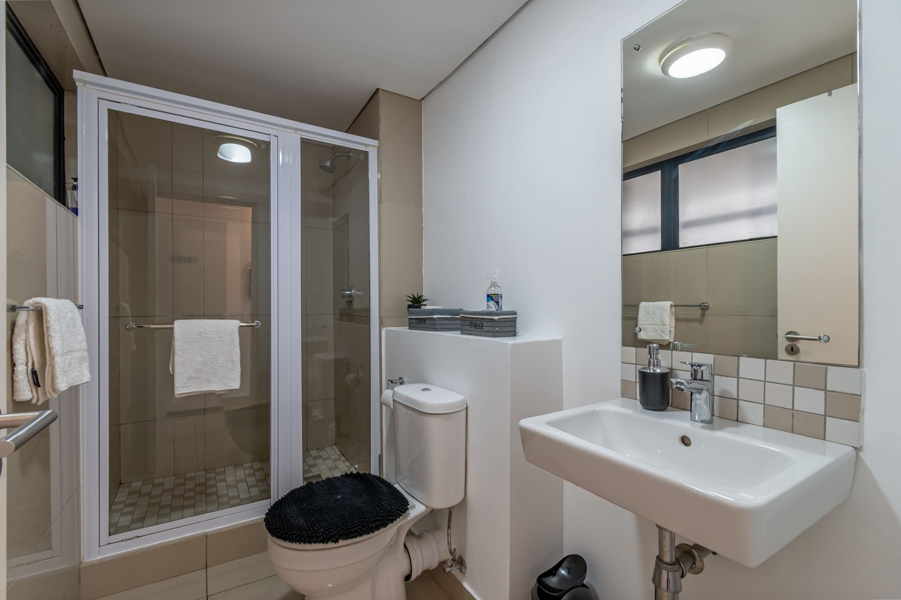 Bathroom with shower, toilet, and basin