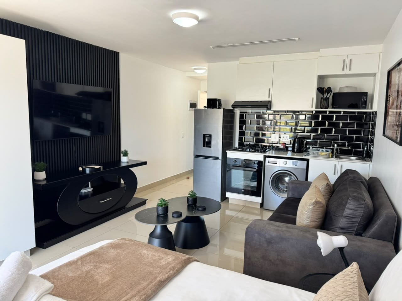 Kitchen with stove, fridge, and dining space
